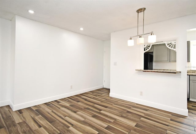 3057 Aaron Burr Ave Unit 1, Winter Park, FL 32792 - unfurnished dining area featuring dark wood-type flooring and recessed lighting
