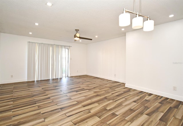 3057 Aaron Burr Ave Unit 1, Winter Park, FL 32792 - spare room with recessed lighting, a textured ceiling, wood finished floors, and a ceiling fan