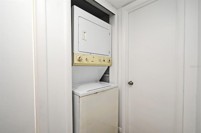 3057 Aaron Burr Ave Unit 1, Winter Park, FL 32792 - laundry room featuring stacked washer / drying machine