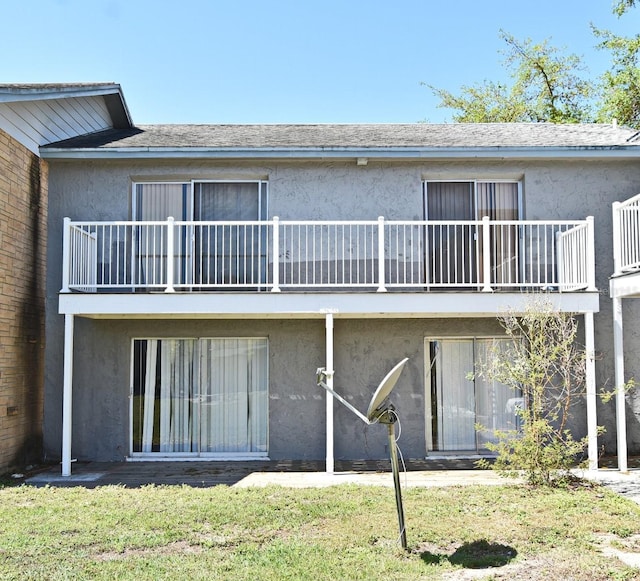 3057 Aaron Burr Ave Unit 1, Winter Park, FL 32792 - rear view of property featuring a balcony and stucco siding