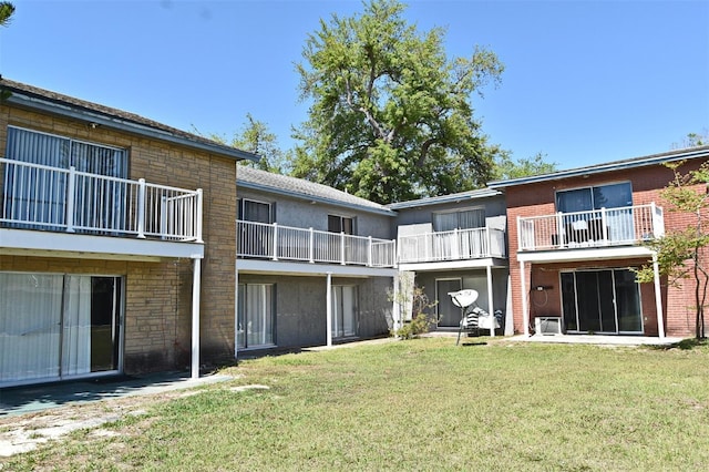 3057 Aaron Burr Ave Unit 1, Winter Park, FL 32792 - rear view of property featuring a yard and brick siding
