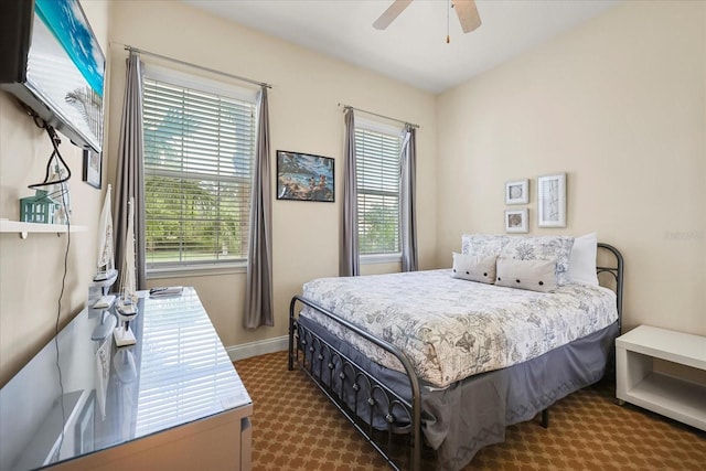 7509 Mourning Dove Cir Unit 204, Reunion, FL 34747 - carpeted bedroom with baseboards and ceiling fan