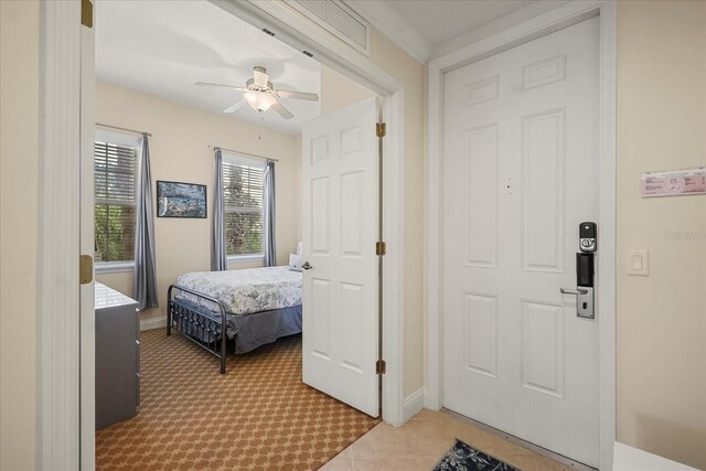 7509 Mourning Dove Cir Unit 204, Reunion, FL 34747 - bedroom with light carpet and ceiling fan