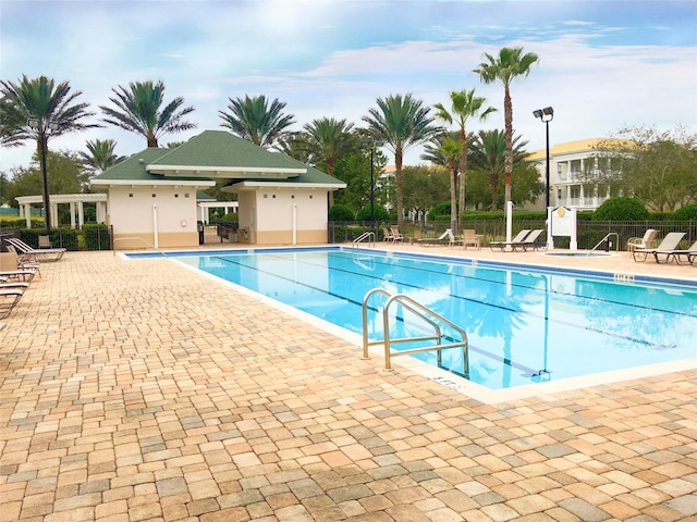 7509 Mourning Dove Cir Unit 204, Reunion, FL 34747 - community pool featuring a patio area