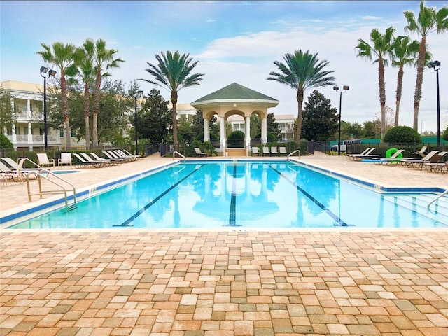 7509 Mourning Dove Cir Unit 204, Reunion, FL 34747 - community pool featuring a patio