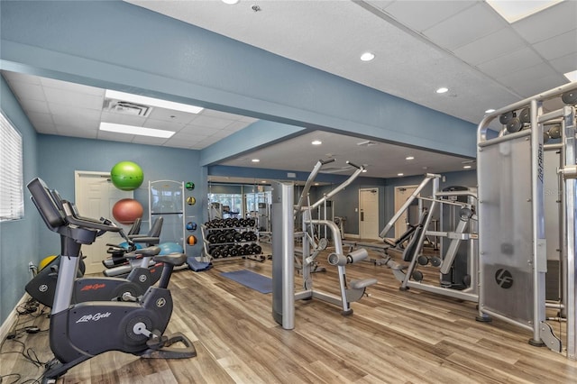 7509 Mourning Dove Cir Unit 204, Reunion, FL 34747 - exercise room featuring wood finished floors, a paneled ceiling, and recessed lighting