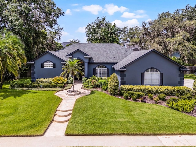 315 Lake Rd, Lake Mary, FL 32746 - single story home featuring stucco siding, a shingled roof, and a front lawn
