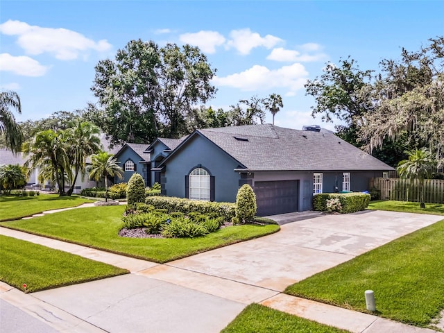 315 Lake Rd, Lake Mary, FL 32746 - single story home with stucco siding, a garage, concrete driveway, and roof with shingles