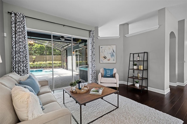 315 Lake Rd, Lake Mary, FL 32746 - living area featuring a sunroom, wood finished floors, and arched walkways