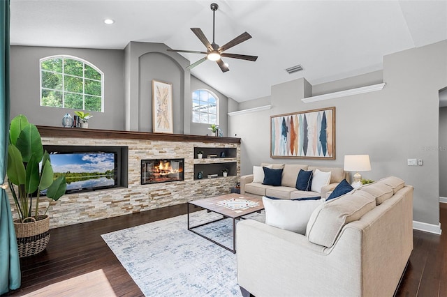 315 Lake Rd, Lake Mary, FL 32746 - living room featuring ceiling fan, healthy amount of natural light, dark wood-style flooring, vaulted ceiling, and a fireplace
