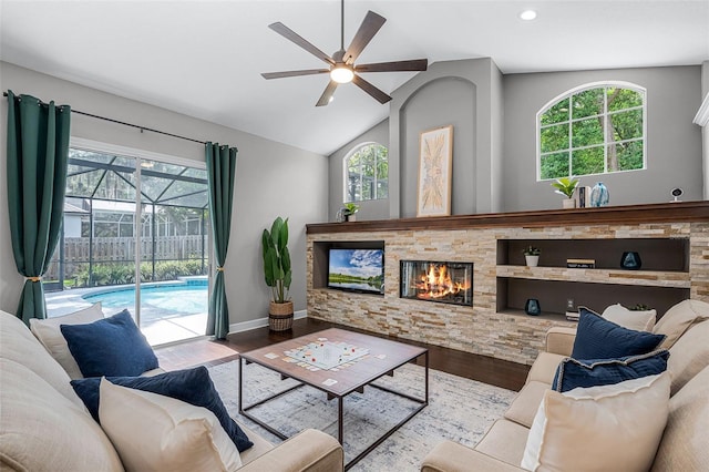 315 Lake Rd, Lake Mary, FL 32746 - living area with a ceiling fan, a sunroom, wood finished floors, plenty of natural light, and vaulted ceiling