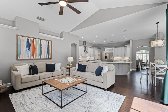 315 Lake Rd, Lake Mary, FL 32746 - living room with arched walkways, a ceiling fan, lofted ceiling, dark wood-style flooring, and recessed lighting