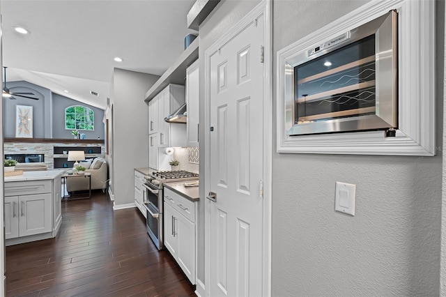 315 Lake Rd, Lake Mary, FL 32746 - kitchen featuring double oven range, tasteful backsplash, open floor plan, a ceiling fan, and vaulted ceiling