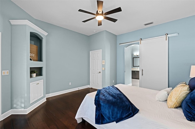 315 Lake Rd, Lake Mary, FL 32746 - bedroom featuring a barn door, wood-type flooring, connected bathroom, and ceiling fan