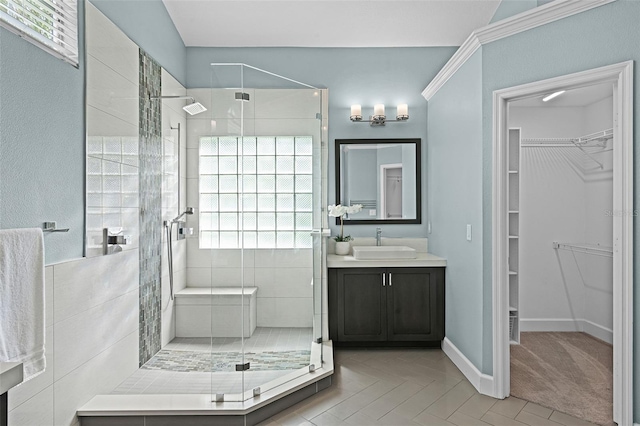 315 Lake Rd, Lake Mary, FL 32746 - bathroom with a shower stall, a spacious closet, and vanity