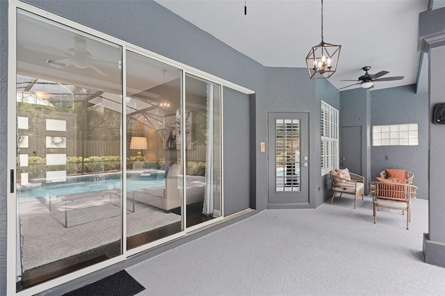 315 Lake Rd, Lake Mary, FL 32746 - doorway with ceiling fan, carpet, and a chandelier