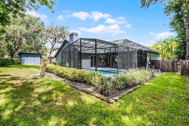 315 Lake Rd, Lake Mary, FL 32746 - rear view of house with a chimney, an outdoor pool, and glass enclosure