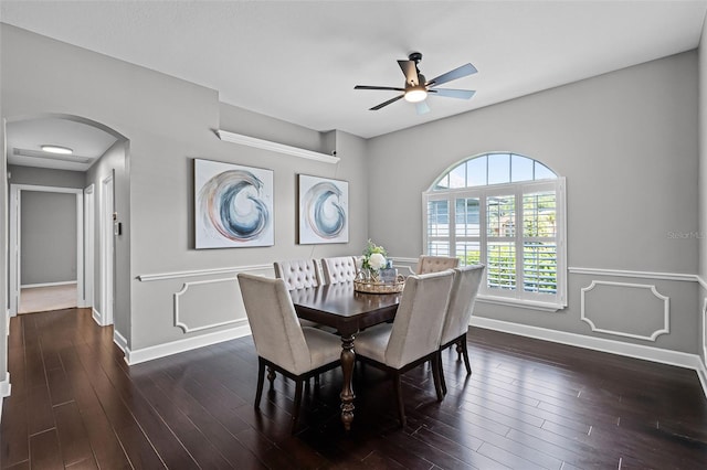 315 Lake Rd, Lake Mary, FL 32746 - dining space featuring arched walkways, a ceiling fan, and dark wood-style floors