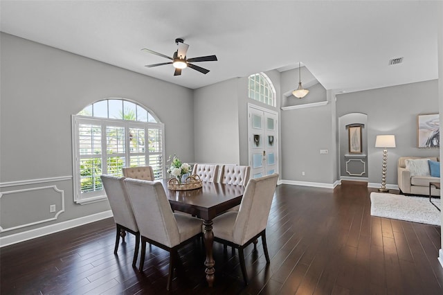 315 Lake Rd, Lake Mary, FL 32746 - dining area with a ceiling fan, arched walkways, and dark wood-type flooring