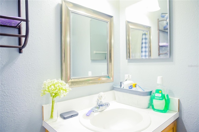 339 Colony Ct, Kissimmee, FL 34758 - bathroom featuring vanity and a textured wall