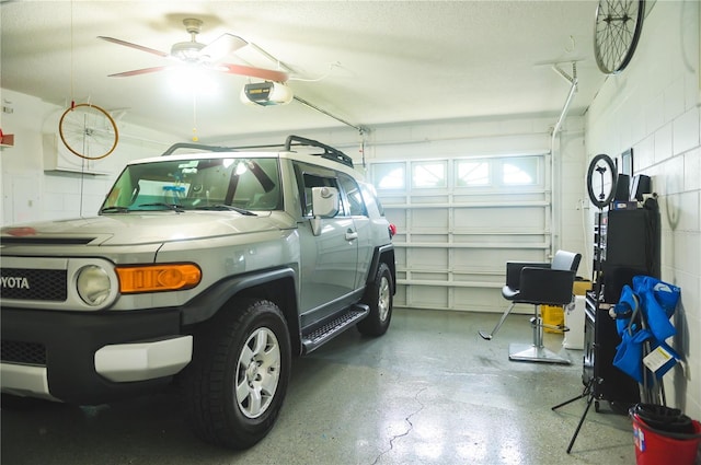 339 Colony Ct, Kissimmee, FL 34758 - garage featuring a garage door opener, concrete block wall, and ceiling fan