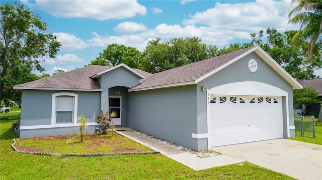339 Colony Ct, Kissimmee, FL 34758 - single story home with roof with shingles, stucco siding, an attached garage, and a front lawn