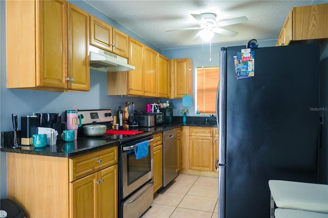 339 Colony Ct, Kissimmee, FL 34758 - kitchen with appliances with stainless steel finishes, under cabinet range hood, ceiling fan, light tile patterned floors, and a textured ceiling
