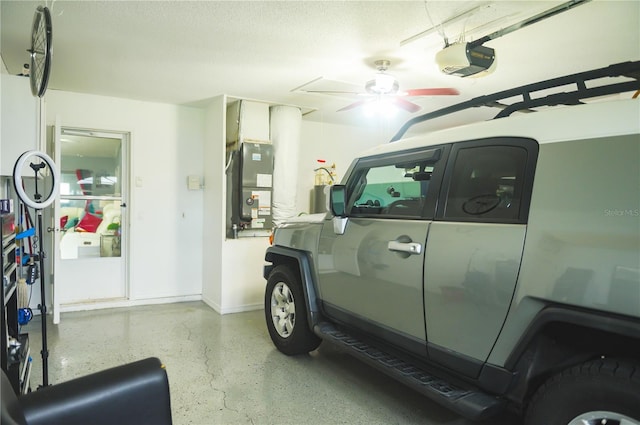 339 Colony Ct, Kissimmee, FL 34758 - garage with a garage door opener, heating unit, and a ceiling fan