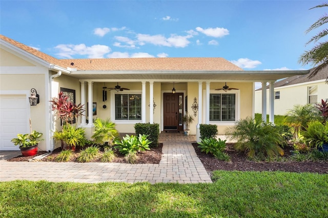 930 Willow Oak Loop, Minneola, FL 34715 - view of front facade featuring ceiling fan, covered porch, and stucco siding