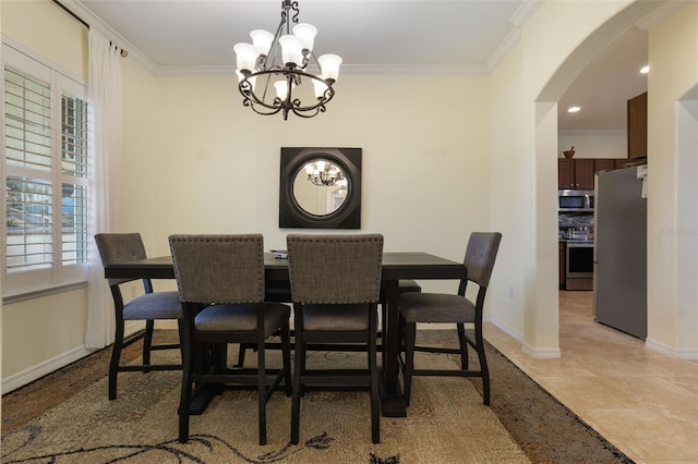 930 Willow Oak Loop, Minneola, FL 34715 - dining area featuring arched walkways, a chandelier, plenty of natural light, and ornamental molding