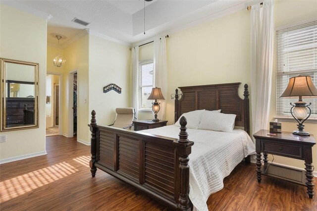 930 Willow Oak Loop, Minneola, FL 34715 - bedroom with wood finished floors, a chandelier, and crown molding