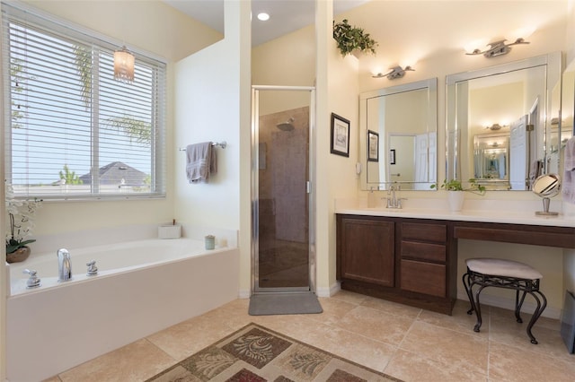 930 Willow Oak Loop, Minneola, FL 34715 - full bathroom with a garden tub, a stall shower, vanity, and tile patterned flooring
