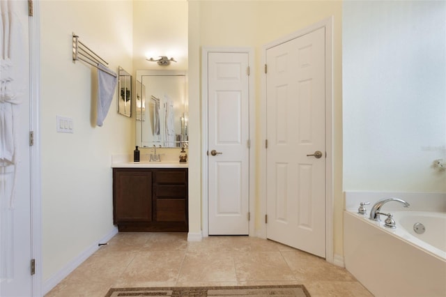 930 Willow Oak Loop, Minneola, FL 34715 - full bathroom with vanity, a bath, and tile patterned floors