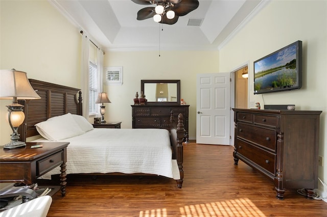930 Willow Oak Loop, Minneola, FL 34715 - bedroom featuring a tray ceiling, wood finished floors, crown molding, and a ceiling fan