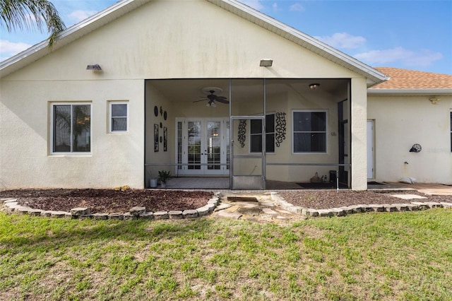930 Willow Oak Loop, Minneola, FL 34715 - back of property featuring french doors, a ceiling fan, a yard, and stucco siding