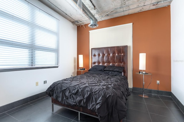 10 N Summerlin Ave Unit 14, Orlando, FL 32801 - tiled bedroom with baseboards