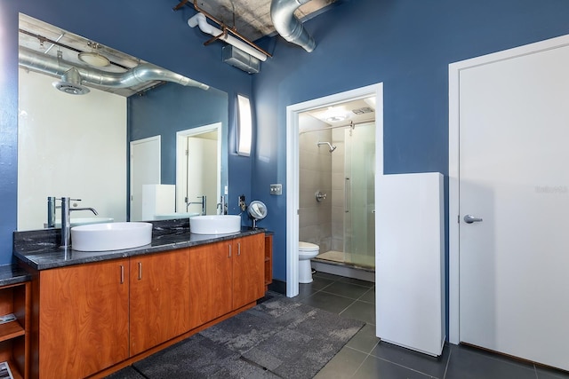 10 N Summerlin Ave Unit 14, Orlando, FL 32801 - bathroom featuring tile patterned flooring, a shower stall, and double vanity