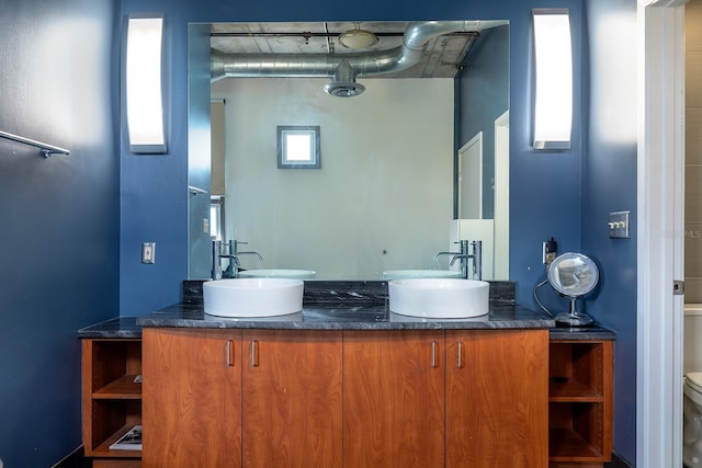 10 N Summerlin Ave Unit 14, Orlando, FL 32801 - bathroom featuring double vanity and toilet