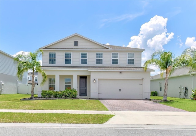 2149 Tudor Rose Dr, Sanford, FL 32773 - view of front of property with an attached garage, decorative driveway, and roof with shingles