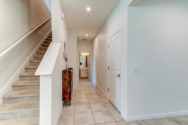 2149 Tudor Rose Dr, Sanford, FL 32773 - hallway featuring stairs and light tile patterned flooring