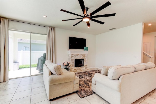 2149 Tudor Rose Dr, Sanford, FL 32773 - living area with ceiling fan, a stone fireplace, recessed lighting, and light tile patterned flooring