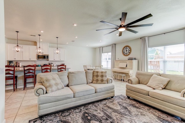 2149 Tudor Rose Dr, Sanford, FL 32773 - living room featuring light tile patterned flooring, a ceiling fan, and recessed lighting