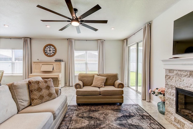 2149 Tudor Rose Dr, Sanford, FL 32773 - living room featuring ceiling fan, a fireplace, light tile patterned floors, and recessed lighting