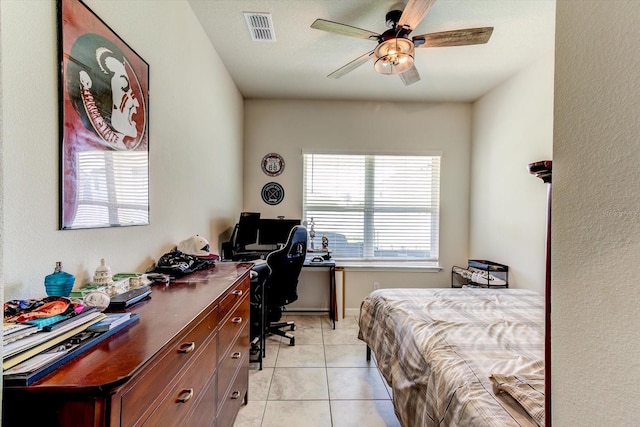 2149 Tudor Rose Dr, Sanford, FL 32773 - bedroom with light tile patterned floors, a desk, and a ceiling fan