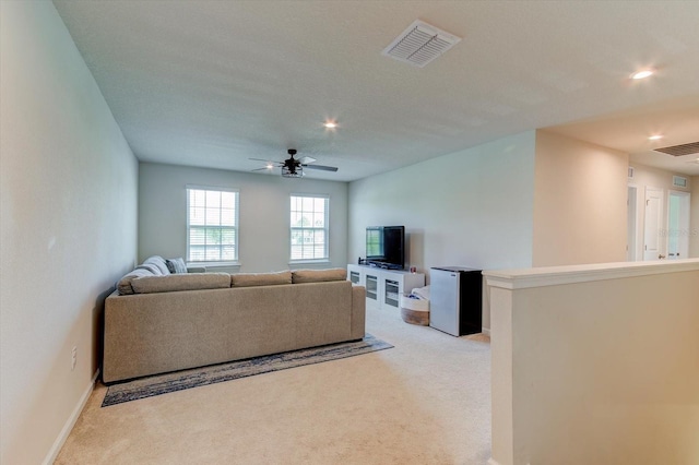 2149 Tudor Rose Dr, Sanford, FL 32773 - living area with light carpet, ceiling fan, and recessed lighting