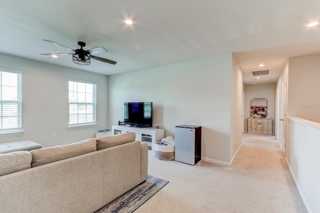 2149 Tudor Rose Dr, Sanford, FL 32773 - living room with light colored carpet, a ceiling fan, and recessed lighting