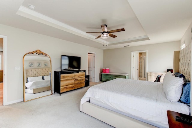 2149 Tudor Rose Dr, Sanford, FL 32773 - bedroom with a tray ceiling, light colored carpet, ceiling fan, and ensuite bath
