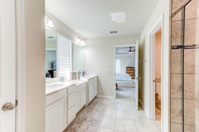 2149 Tudor Rose Dr, Sanford, FL 32773 - ensuite bathroom featuring double vanity, a ceiling fan, tiled shower, and tile patterned floors