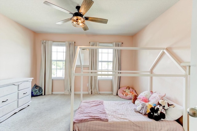 2149 Tudor Rose Dr, Sanford, FL 32773 - carpeted bedroom with baseboards and a ceiling fan