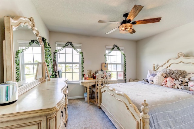2149 Tudor Rose Dr, Sanford, FL 32773 - bedroom with light carpet, a textured ceiling, and a ceiling fan